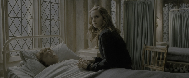 Wide shot frame from Harry Potter and the Half-Blood Prince — sitting, room, bed