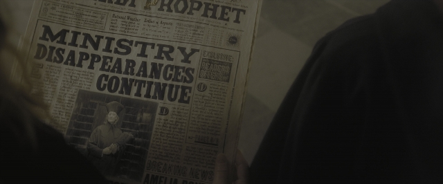 Wide shot frame from Harry Potter and the Half-Blood Prince — standing, suit, tie