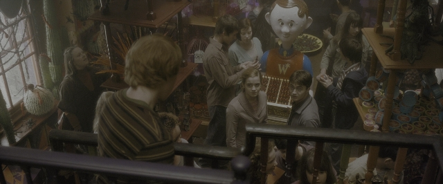 Wide shot frame from Harry Potter and the Half-Blood Prince — standing, plate, room