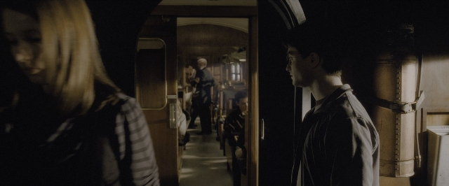 Wide shot frame from Harry Potter and the Half-Blood Prince — standing, car, shirt