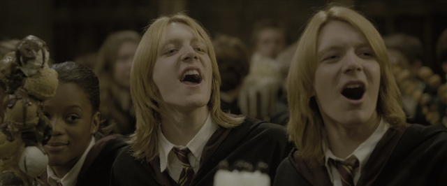 Medium shot frame from Harry Potter and the Goblet of Fire — standing, room, face
