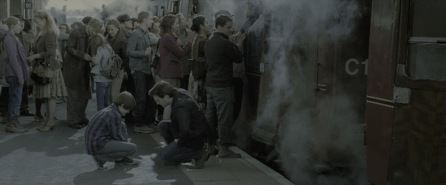 Wide shot frame from Harry Potter and the Deathly Hallows - Part 2 — standing, door, train