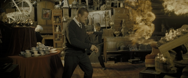 Wide shot frame from Harry Potter and the Deathly Hallows - Part 2 — room, table, fire