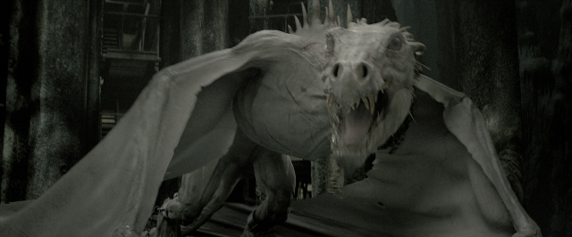 Wide shot frame from Harry Potter and the Deathly Hallows - Part 2 — standing, smoke, statue sculpture