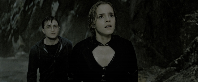 Wide shot frame from Harry Potter and the Deathly Hallows - Part 2 — standing, hair, smoke