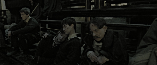 Wide shot frame from Harry Potter and the Deathly Hallows - Part 2 — sitting, room, train