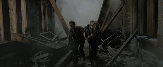 Wide shot frame from Harry Potter and the Deathly Hallows - Part 2 — walking, smoke, person
