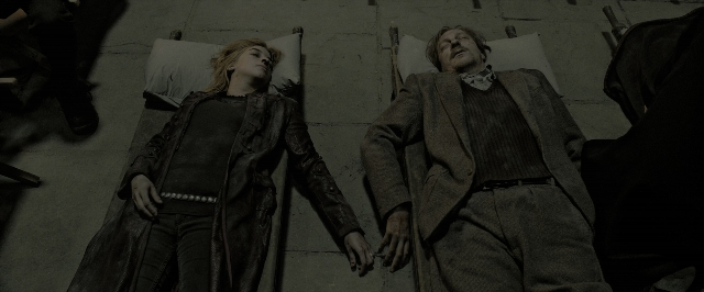 Wide shot frame from Harry Potter and the Deathly Hallows - Part 2 — room, bed, suit