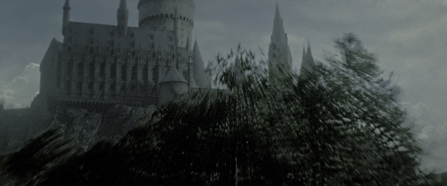 Wide shot frame from Harry Potter and the Deathly Hallows - Part 2 — snow, castle