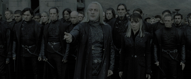 Wide shot frame from Harry Potter and the Deathly Hallows - Part 2 — standing, coat, hand