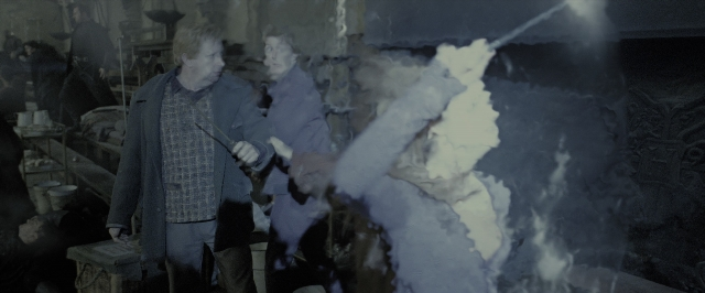 Wide shot frame from Harry Potter and the Deathly Hallows - Part 2 — standing, room, hand