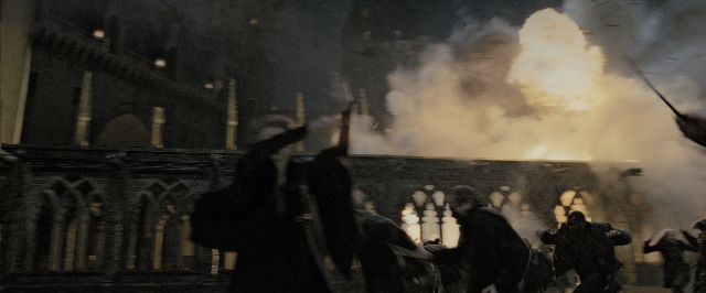 Wide shot frame from Harry Potter and the Deathly Hallows - Part 2 — fire, smoke, person