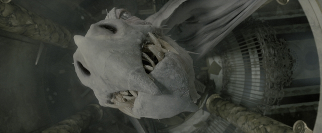 Wide shot frame from Harry Potter and the Deathly Hallows - Part 2 — smoke, skull