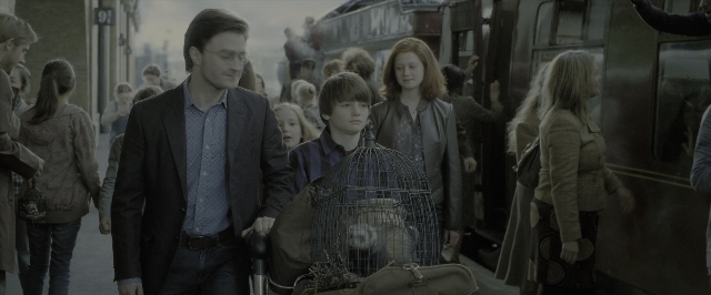 Wide shot frame from Harry Potter and the Deathly Hallows - Part 2 — walking, street, coat