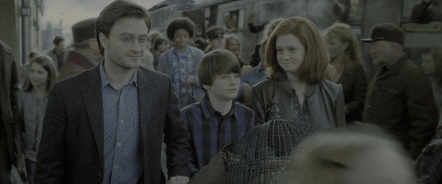 Wide shot frame from Harry Potter and the Deathly Hallows - Part 2 — walking, street, suit