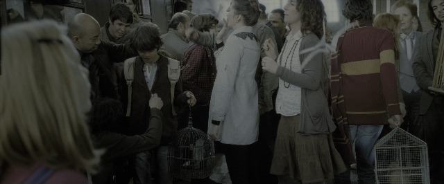 Wide shot frame from Harry Potter and the Deathly Hallows - Part 2 — standing, street, train