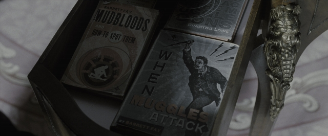 Wide shot frame from Harry Potter and the Deathly Hallows - Part 1 — book, bed, person