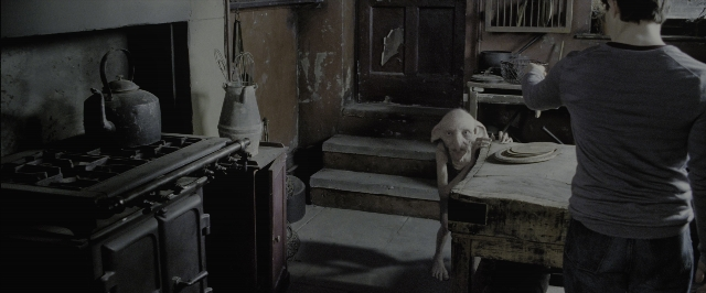 Wide shot frame from Harry Potter and the Deathly Hallows - Part 1 — standing, plate, room