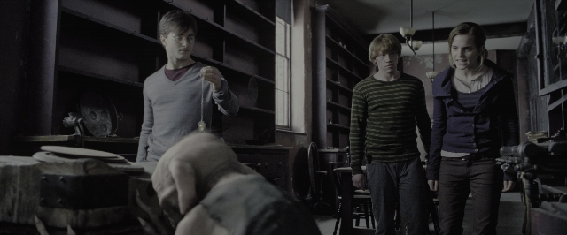 Wide shot frame from Harry Potter and the Deathly Hallows - Part 1 — standing, dialogue, hand