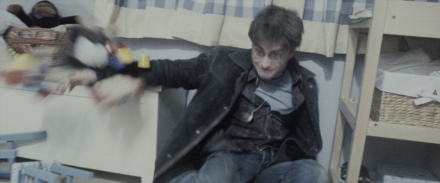 Wide shot frame from Harry Potter and the Deathly Hallows - Part 1 — sitting, room, bed