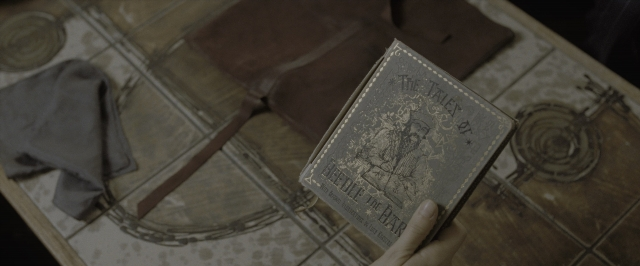 Wide shot frame from Harry Potter and the Deathly Hallows - Part 1 — book, plate, table