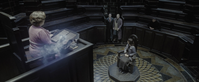 Wide shot frame from Harry Potter and the Deathly Hallows - Part 1 — sitting, book, standing
