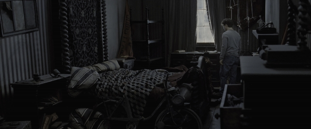 Wide shot frame from Harry Potter and the Deathly Hallows - Part 1 — standing, room, bed