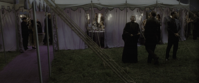 Wide shot frame from Harry Potter and the Deathly Hallows - Part 1 — sitting, night, tent