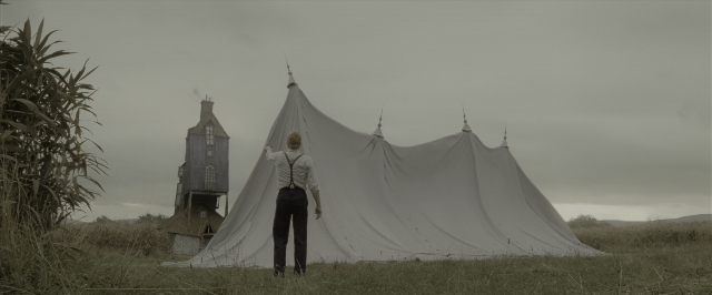 Wide shot frame from Harry Potter and the Deathly Hallows - Part 1 — standing, tent, shirt