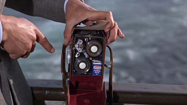 Wide shot frame from From Russia with Love — standing, suit, face