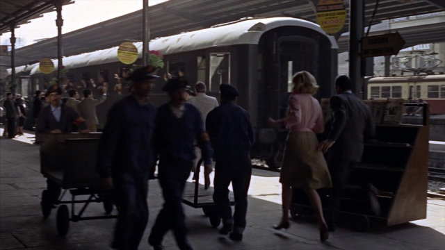 Wide shot frame from From Russia with Love — standing, walking, train