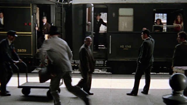 Wide shot frame from From Russia with Love — standing, walking, suit