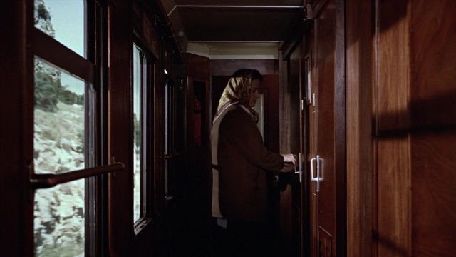 Medium shot frame from From Russia with Love — standing, door, car