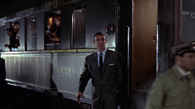 Wide shot frame from From Russia with Love — standing, hat, uniform