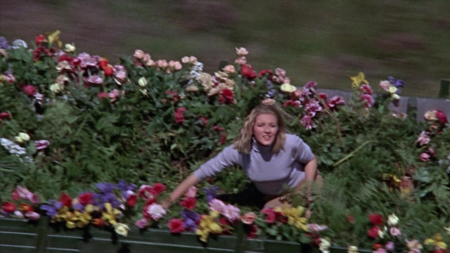 Wide shot frame from From Russia with Love — sitting, bed, shirt
