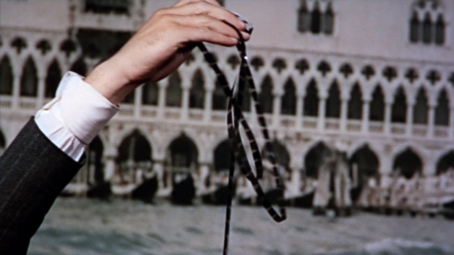 Medium shot frame from From Russia with Love — hand, suit, shirt
