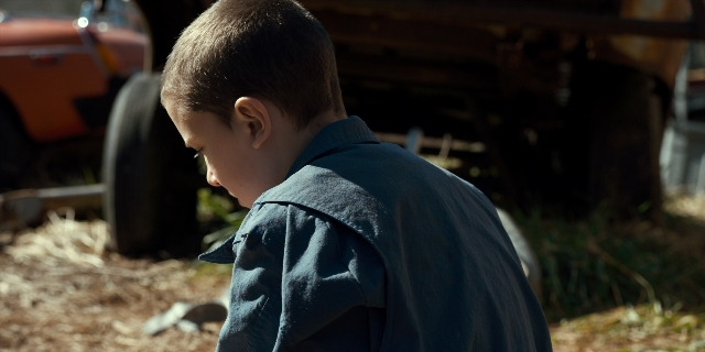 Wide shot frame from Stranger Things — standing, shirt, face