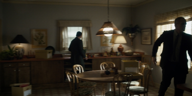 Wide shot frame from Stranger Things — sitting, standing, walking