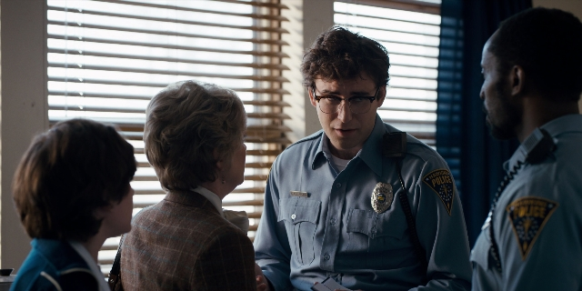 Wide shot frame from Stranger Things — room, dialogue, uniform
