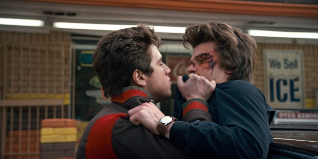 Wide shot frame from Stranger Things — watch, hand, face