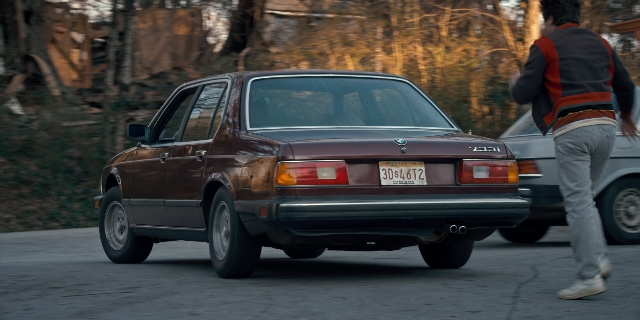 Wide shot frame from Stranger Things — walking, plate, door