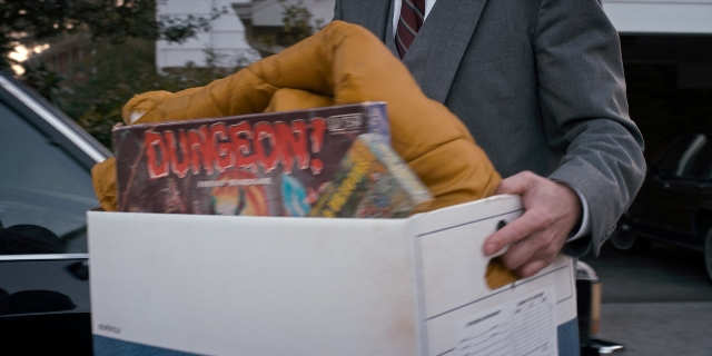 Wide shot frame from Stranger Things — book, standing, street