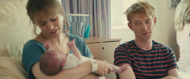 Wide shot frame from About Time — sitting, bed, shirt