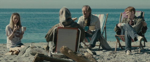 Wide shot frame from About Time — sitting, book, dialogue