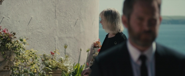 Frame from About Time — walking, suit, tie