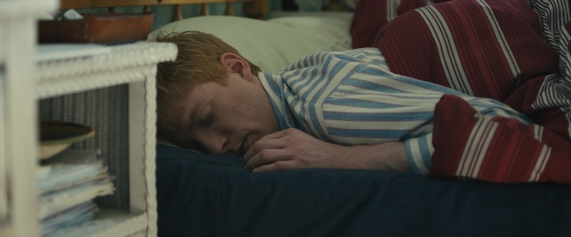 Wide shot frame from About Time — bed, shirt, bedroom