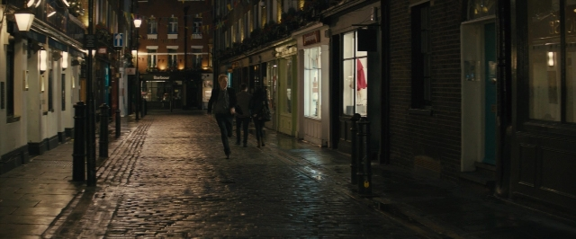 Wide shot frame from About Time — walking, street, night