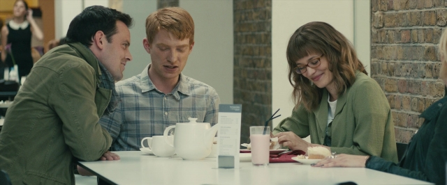 Wide shot frame from About Time — sitting, plate, table