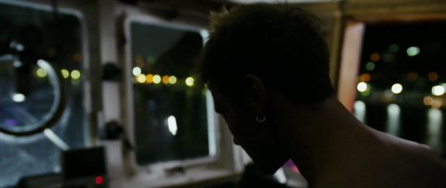 Wide shot frame from Kak menya zovut — sitting, car, night