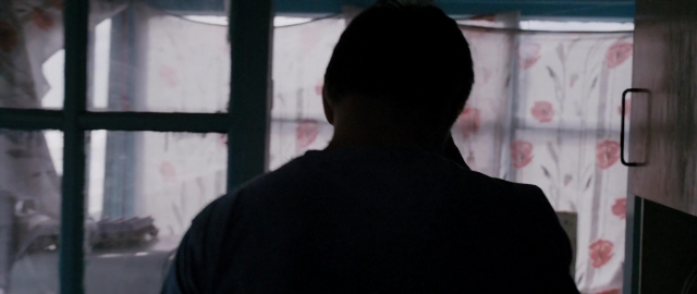 Frame from Kak menya zovut — standing, bed, person
